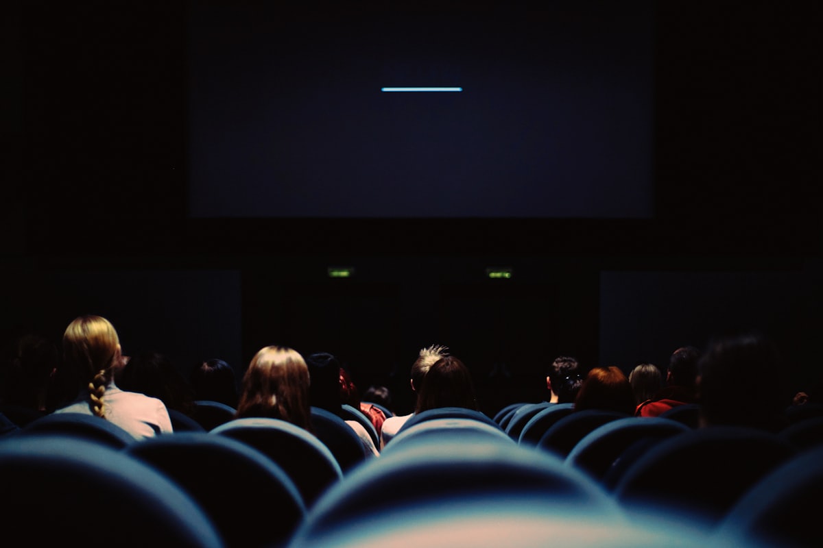 Audience watching a movie on the big screen