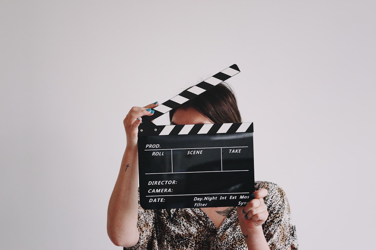Director holding a clapperboard on set